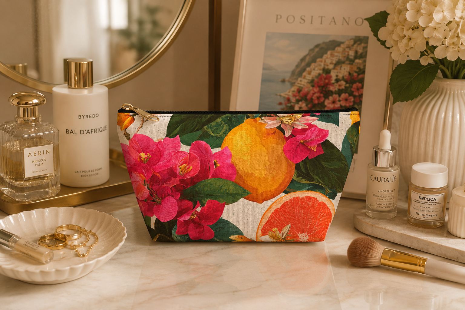Floral citrus pouch on a vanity table with skincare products.