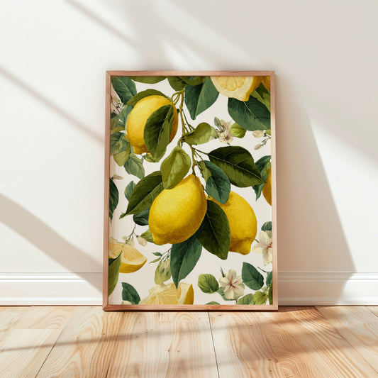 Framed artwork of lemons and leaves on a white wall.