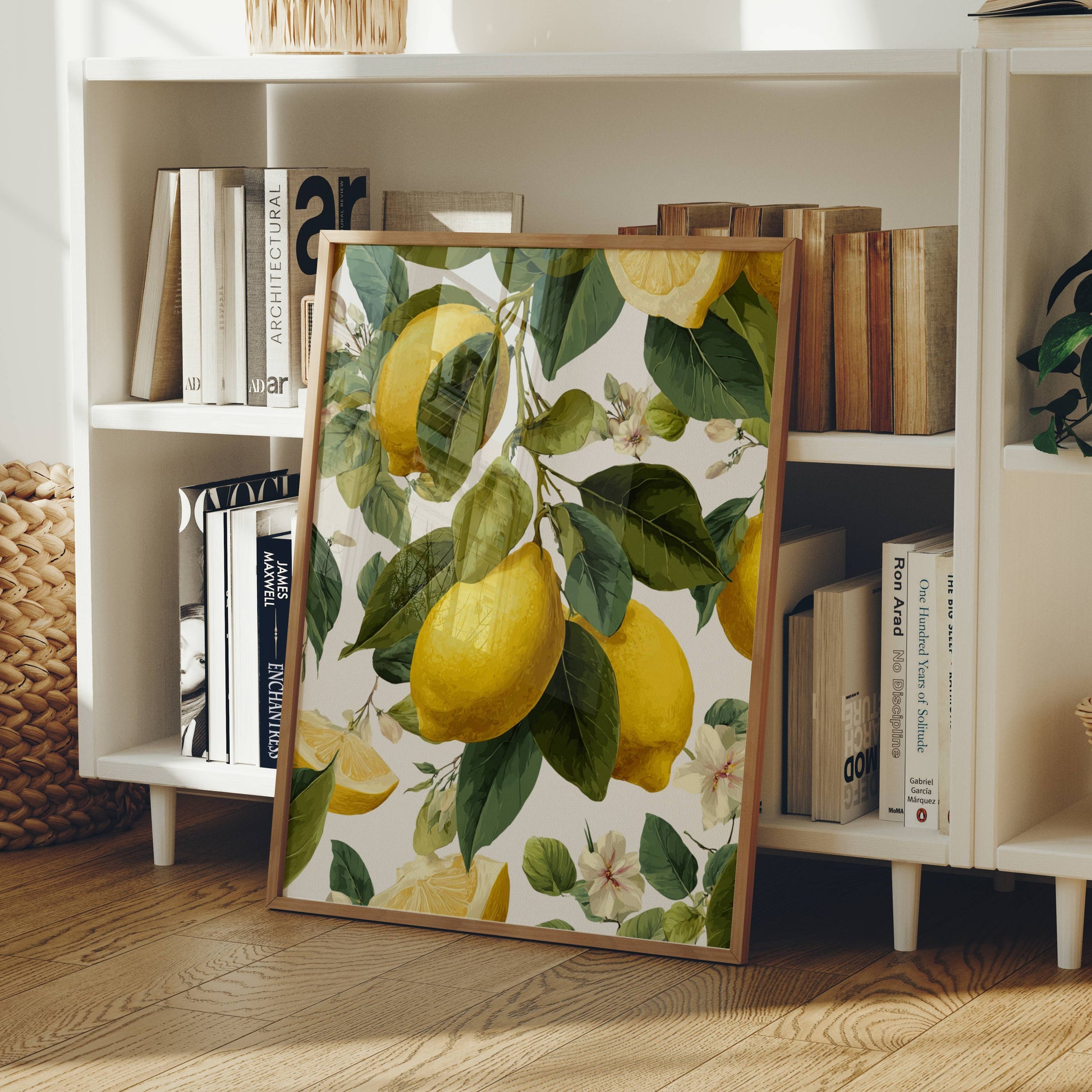 Framed artwork with lemon design on a bookshelf
