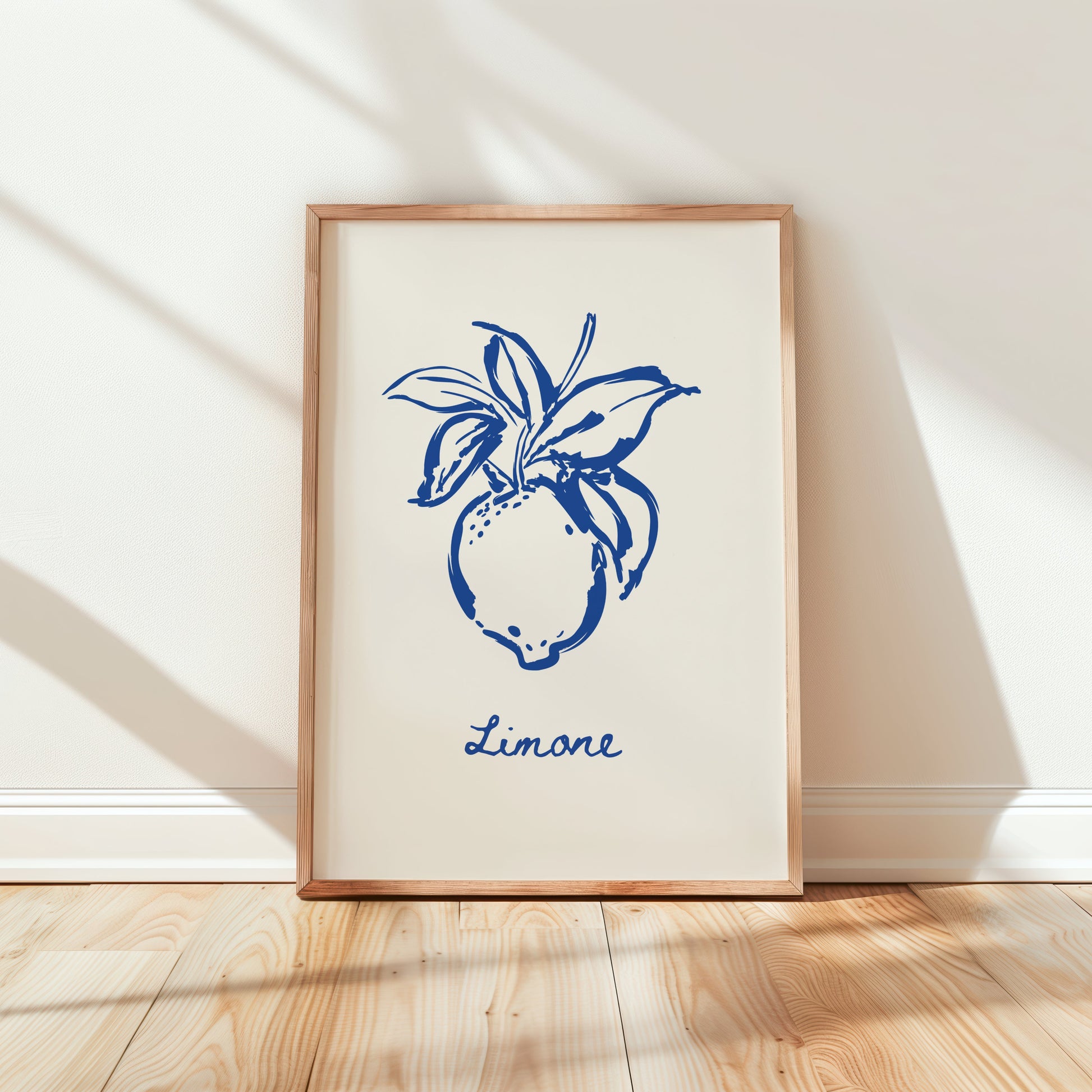 Framed artwork with blue design and 'Limone' text on a white wall.