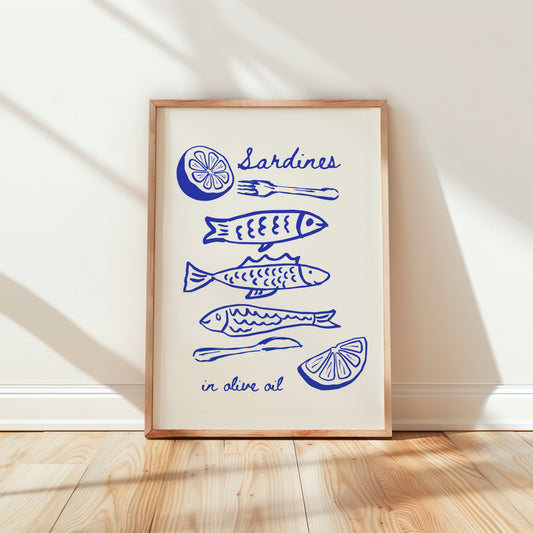 Framed artwork with blue sardine fish illustrations and text on a white wall.