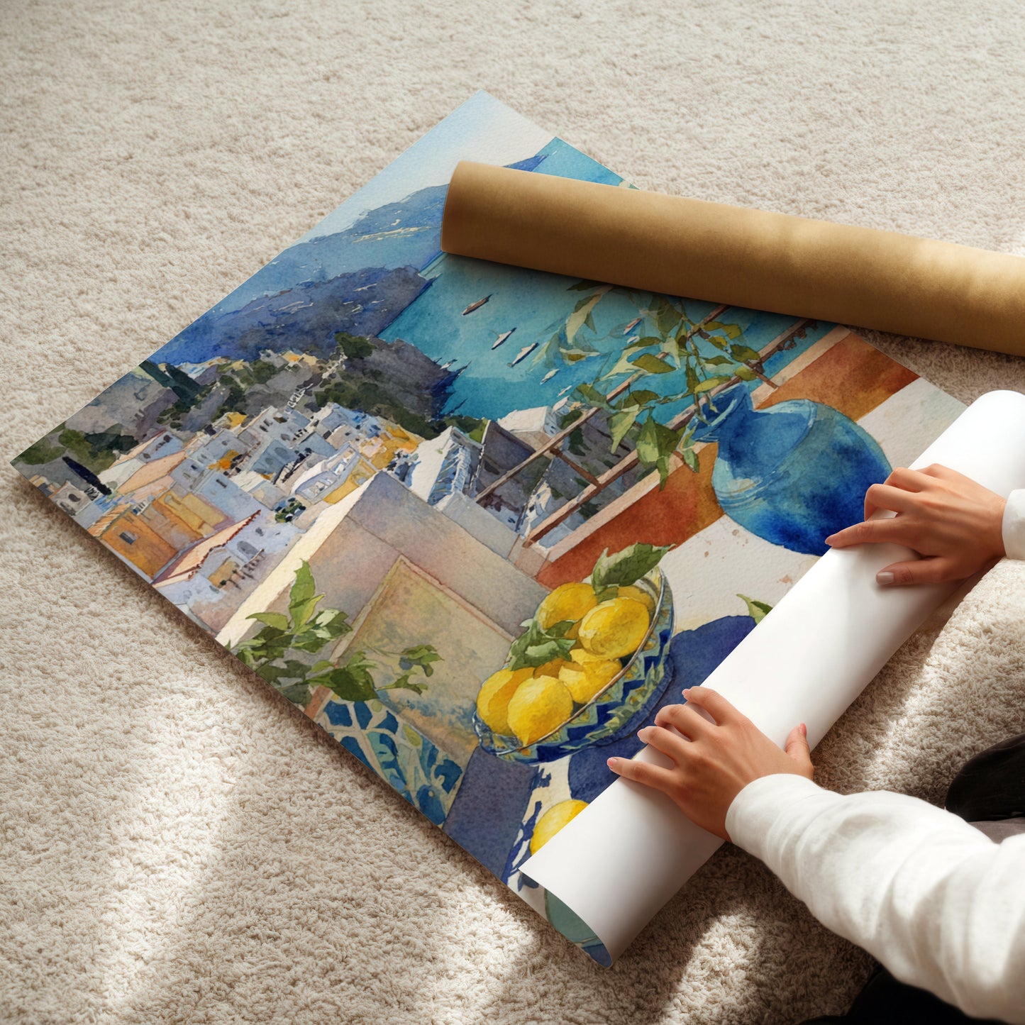 Person unrolling a large colorful watercolor Positano painting on a carpeted floor